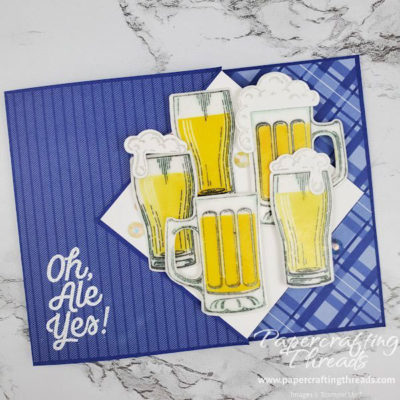 Diamond Flip Fold card front with beer mugs and pilsner glasses grouped as focal point, with mirrored stamping images