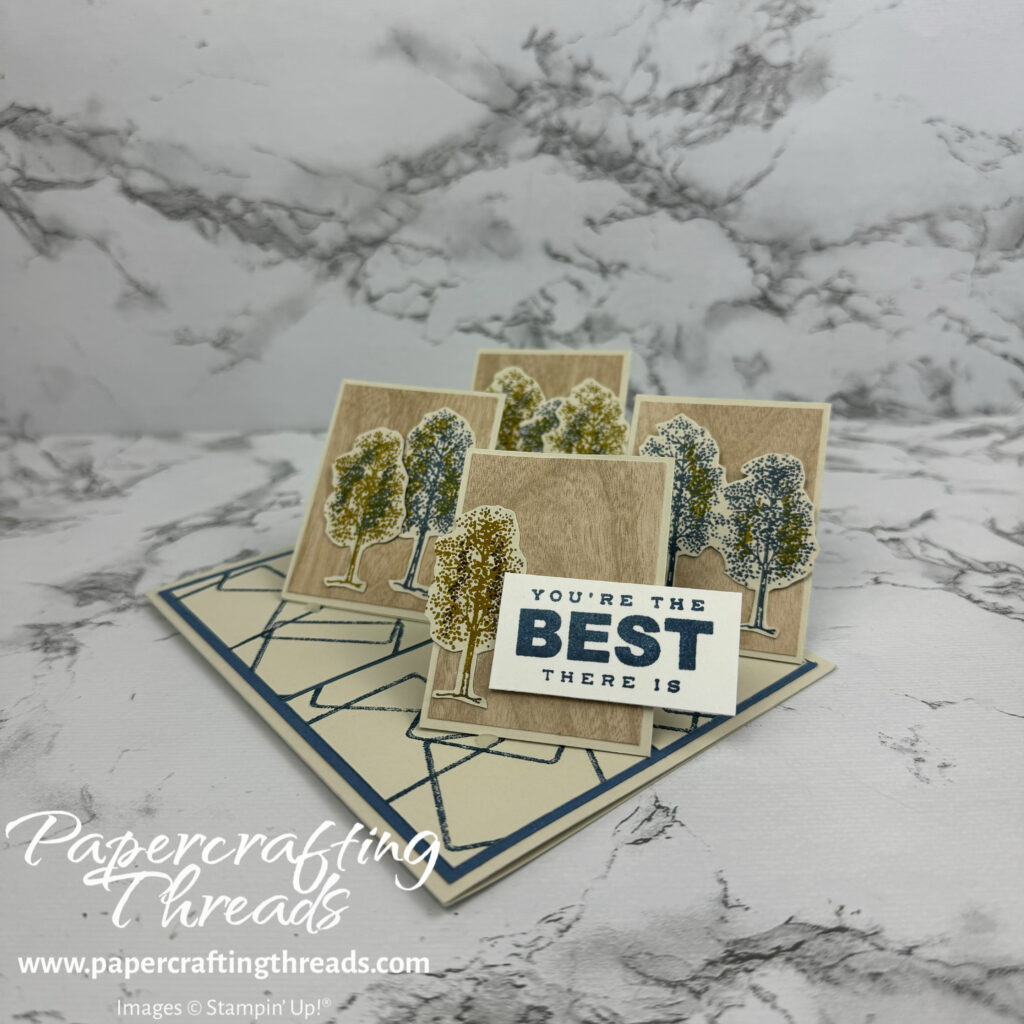 Quadruple Easel Fun Fold Card with standing pieces of cardstock displaying trees. Colors are basic beige, crumb cake woodgrain and misty moonlight blue. Sentiment says you're the best there is.