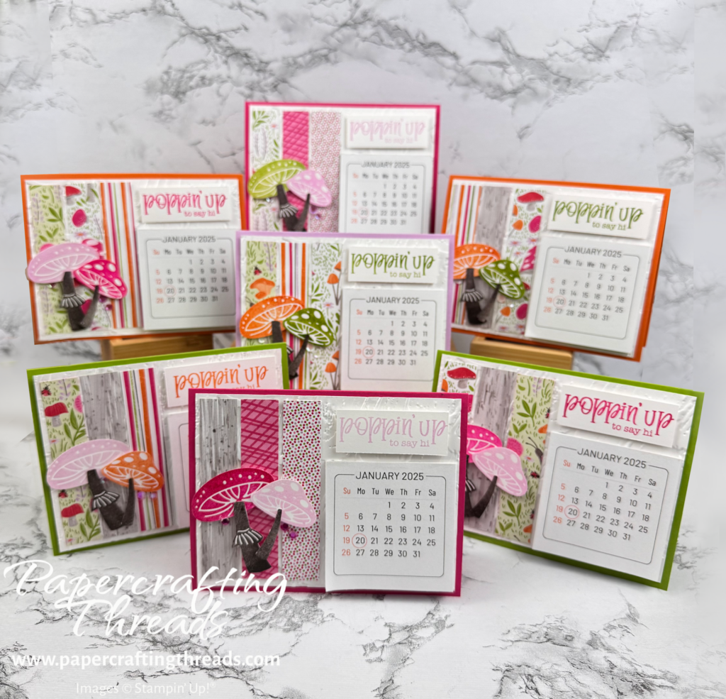 Assorted stand-alone Mini Calendars in bright colors with a whimsical toadstool theme.