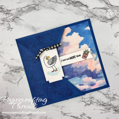 Swing Arm Card with Friendly Seagulls. Blueberry Bushel card front with pull out cloud pattern. Seagull with greeting of 'I love you more than' with an image of a box of French fries.