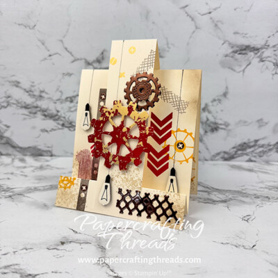 Pop Up Easel Card with a steampunk theme of gears, edison lights and textures, all in cream, deep red, golds and dark bronze.