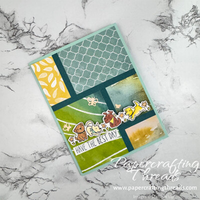 Cutest Crew Mosaic (or How to Use Up Scraps) shows a greeting card with multiple patterns of paper separated by solid strips of color. Colors are turquoises, greens and yellows. A group of 5 puppies span the card front with butterflies fluttering overhead. Greeting reads 'have the best day'.