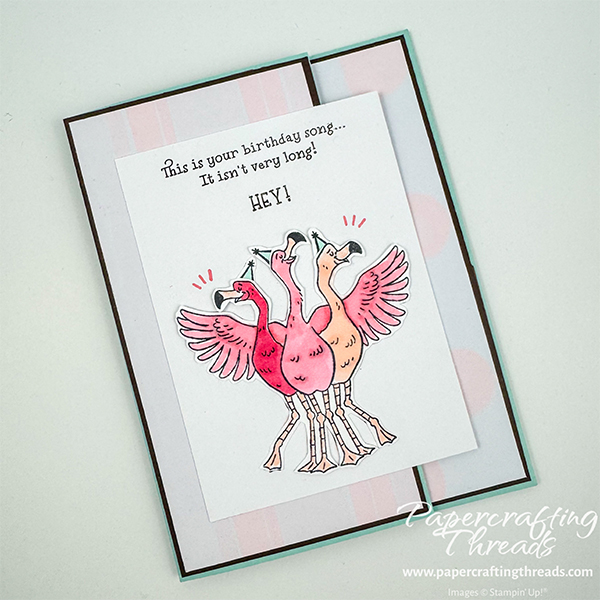 Secret Slider Card has a Pool Party base, with Early Espresso layers behind Barely Blush stripes and dots patterns. Three pink flamingos grace the front with the greeting "this is your birthday song...it isn't very long! HEY!"