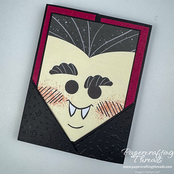 Pocket Gatefold Card has a black card base with deep Cherry Cobbler red embossed panels. Two overlapping right triangles form a pocket to hold the vampire face insert.