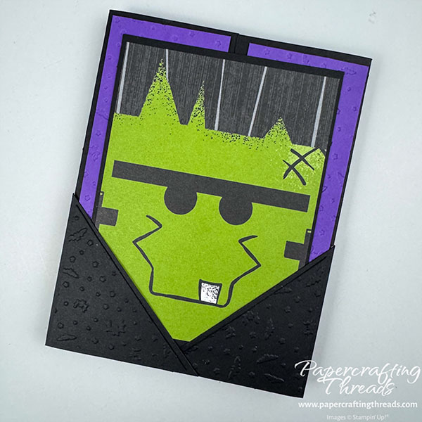Pocket Gatefold Card has a black card base with deep Gorgeous Grape purple embossed panels. Two overlapping right triangles form a pocket to hold the Frankenstein face insert.