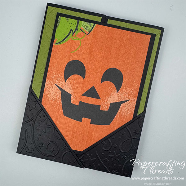 Pocket Gatefold Card has a black card base with deep Old Olive green embossed panels. Two black embossed overlapping right triangles form a pocket to hold the jack o'lantern face insert.